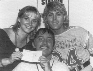Cheryl Baker and Mike Nolan present a cheque to Stuart Henry